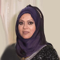 Photo of Lailey Hashem - woman with purple hijab and black shirt.