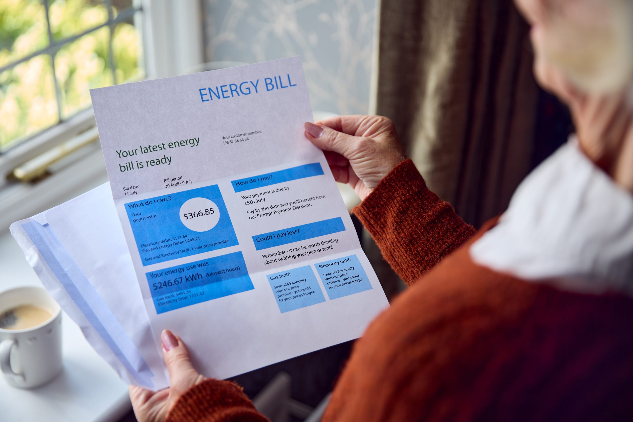 Close,up,of,senior,woman,opening,uk,energy,bill,concerned